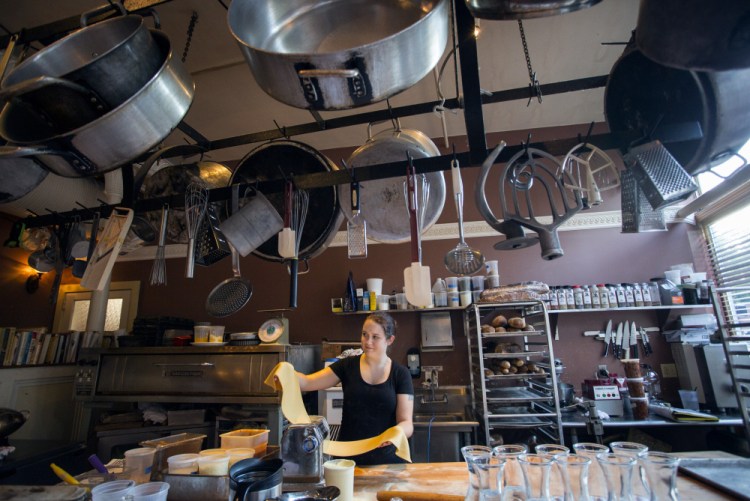 Brianne Shea, a prep cook at The Corner Room, prepares fresh lasagna noodles. Many of the restaurant's pastas are made in house.