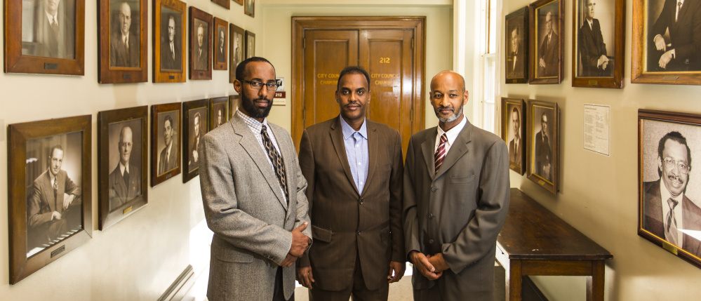 Immigrant leaders gather in City Hall after announcing the launch of New Mainers Alliance. From left: Mahmoud Hassan, the new group's co-founder and president of Somali Community Center of Maine; Abdifatah Ahmed, chairman of the alliance; and Elmuatz Abdelrahim, co-founder of the alliance.