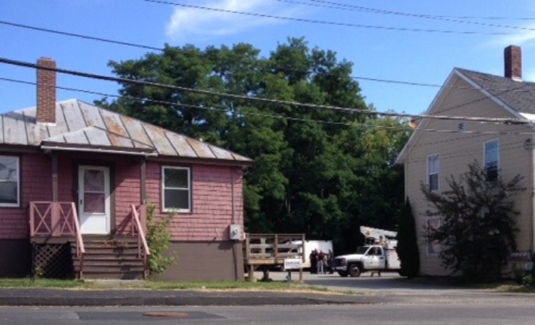 Police converge at an apartment building on Union Street in Waterville Thursday morning following a report of an assault involving a hammer.