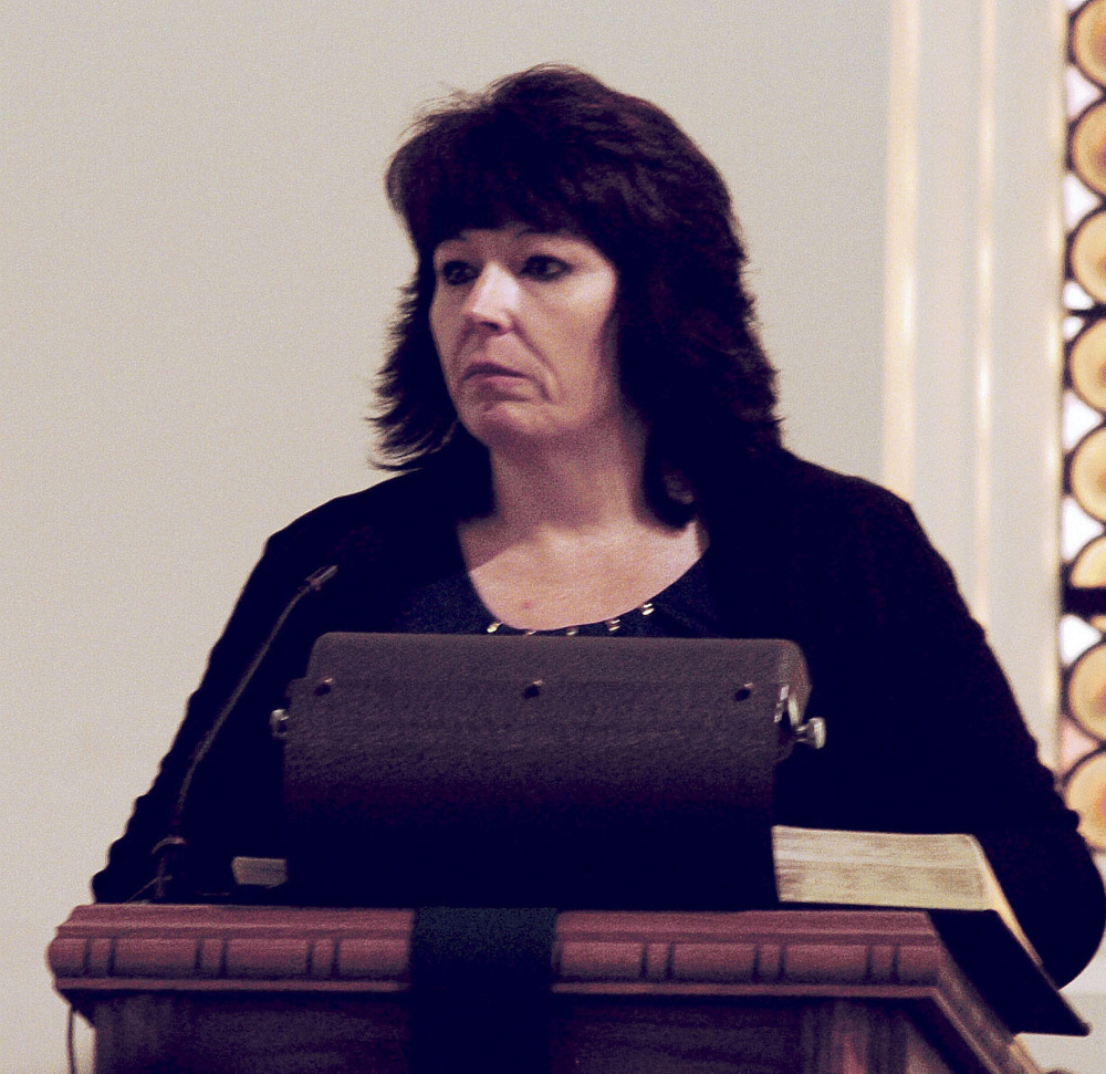 Tammy Meunier-Pease cried as she read a poem at a memorial for Valerie Tieman at the Fairfield United Methodist Church on Sunday.