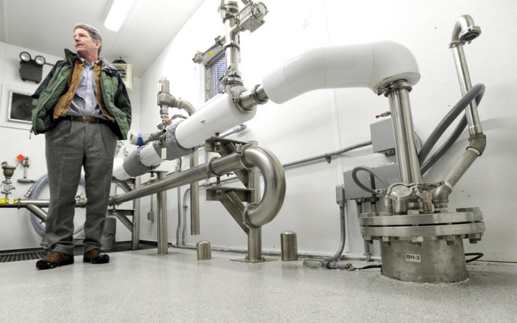 Thomas Brennan, a Poland Spring manager, stands in 2011 near a well head, right, that supplies water to the Hollis bottling plant.