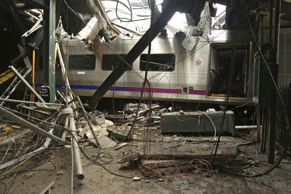 A commuter train sits damaged after last week's crash in New Jersey. The National Transportation Safety Board said the throttle was increased approximately 38 seconds before the collision and the train speeded up.