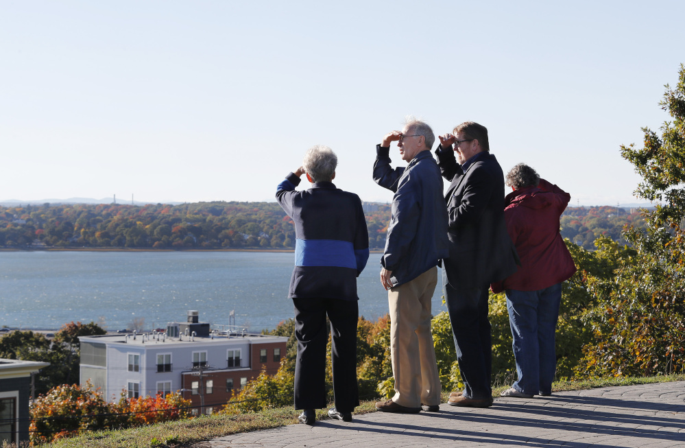 Jane Ives, Cliff Ives, Jeff Taylor and Mary Taylor take in the view from Munjoy Hill's Fort Sumner Park on Monday. Portland City Councilor Belinda Ray wants to enact a two-month moratorium on development projects abutting public open space in the East End.