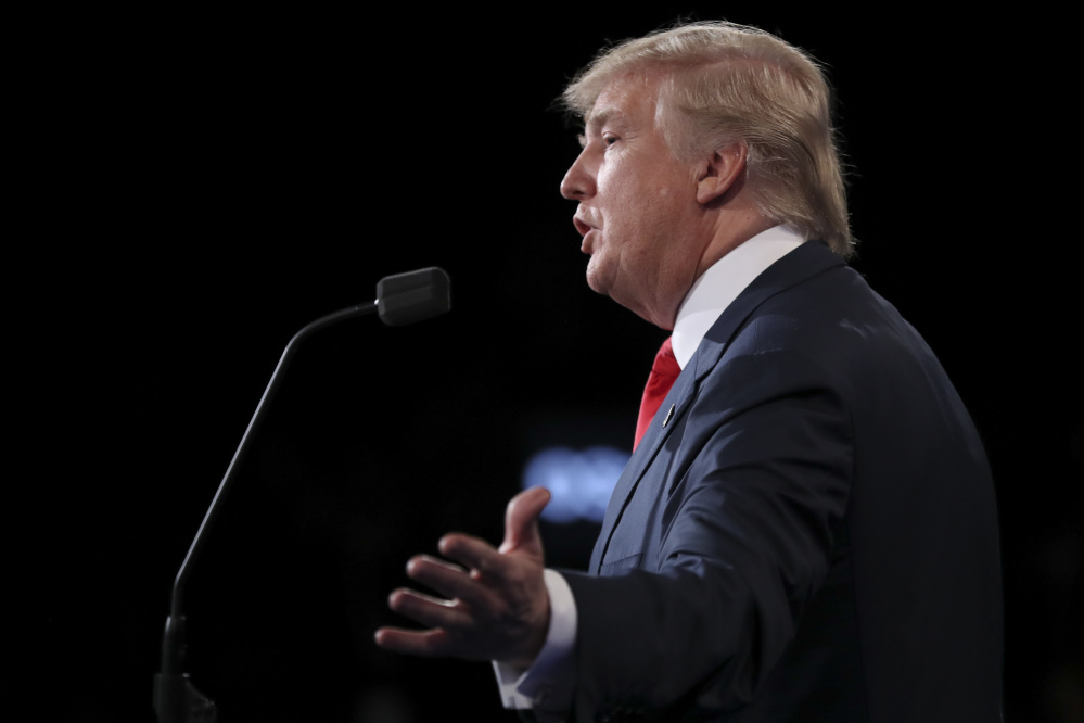 Republican presidential nominee Donald Trump answers a question during the third presidential debate at UNLV in Las Vegas, Wednesday.