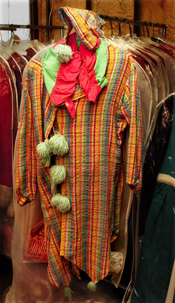 A clown costume hangs on a rack at Are You Ready To Party company in Waterville.