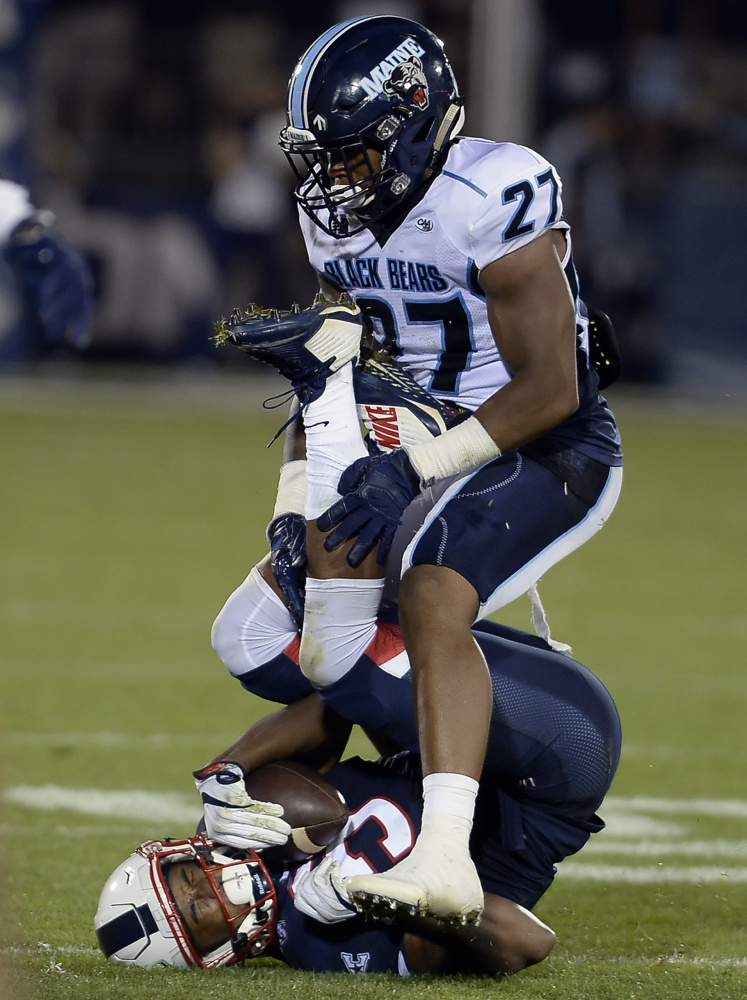 Safety DeAndre Scott, top, is one of the banged up Black Bears. He'll likely miss his third straight game Saturday because of a sprained foot.