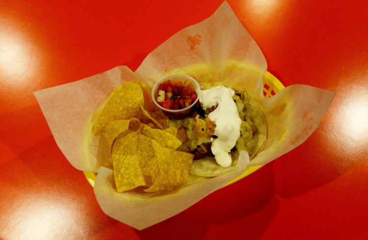 Pascada taco, a Mexican beer battered fish with vegetales en escabeche (slaw) & lime sour cream mayo. Shawn Patrick Ouellette/Staff Photographer