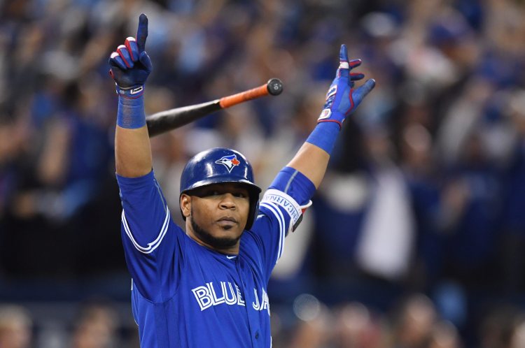 Toronto's Edwin Encarnacion celebrates after hitting a game-winning three-run home run against Baltimore during the 11th inning Tuesday.    Frank Gunn/The Canadian Press via AP