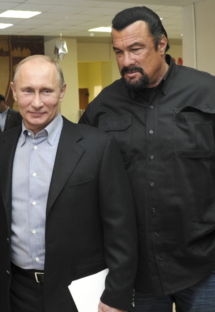 Russian President Vladimir Putin, left, and U.S. movie actor Steven Seagal visit a new sports arena in Moscow in 2013.
Alexei Nikolsky/Sputnik, Kremlin Pool Photo via AP