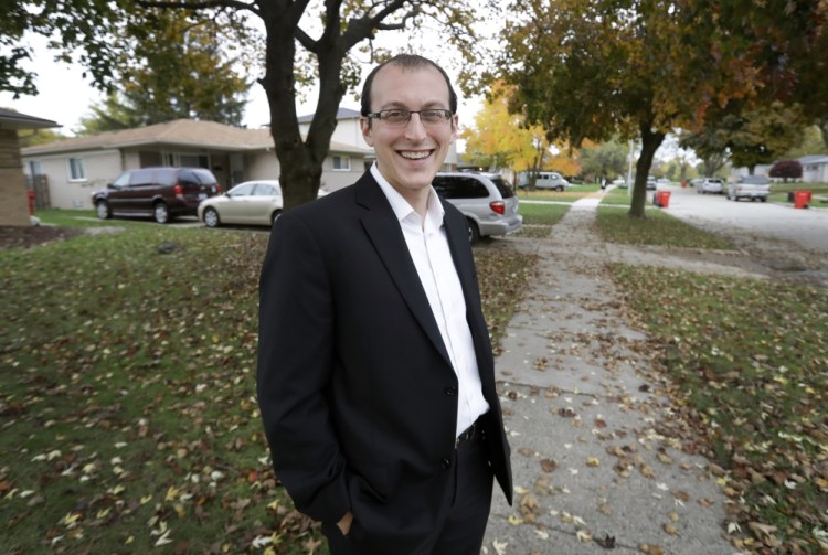 Moshe Sherizen, an undecided voter, is shown outside his home in Southfield, Mich. An undecided voter, Sherizen considers himself a Democrat but also a risk-taker and likes Trump's pledge of tough immigration policies to keep out potential terrorists.