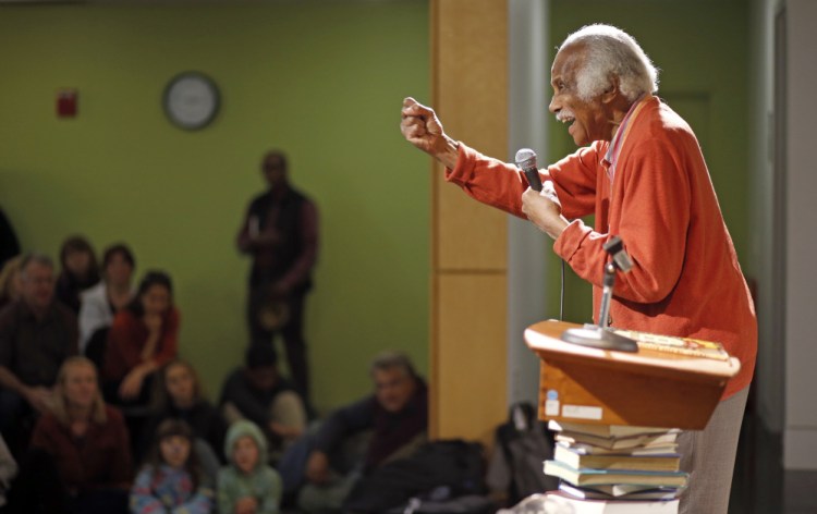 Author-illustrator Ashley Bryan speaks Saturday at the Portland Public Library. In his new children's book, "Freedom Over Me," Bryan tackles the topic of slavery.