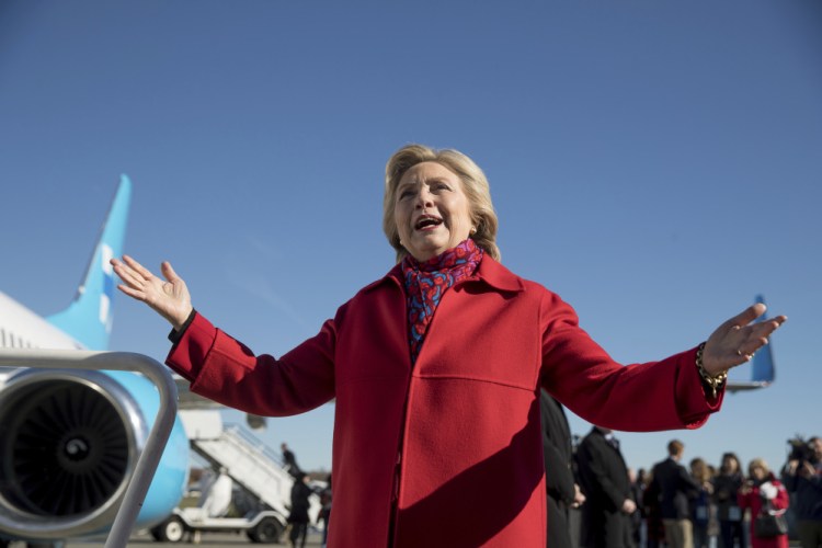 Democratic presidential candidate Hillary Clinton speaks to members of the media before boarding her campaign plane at Westchester County Airport in White Plains, N.Y., Monday to travel to Pittsburgh.