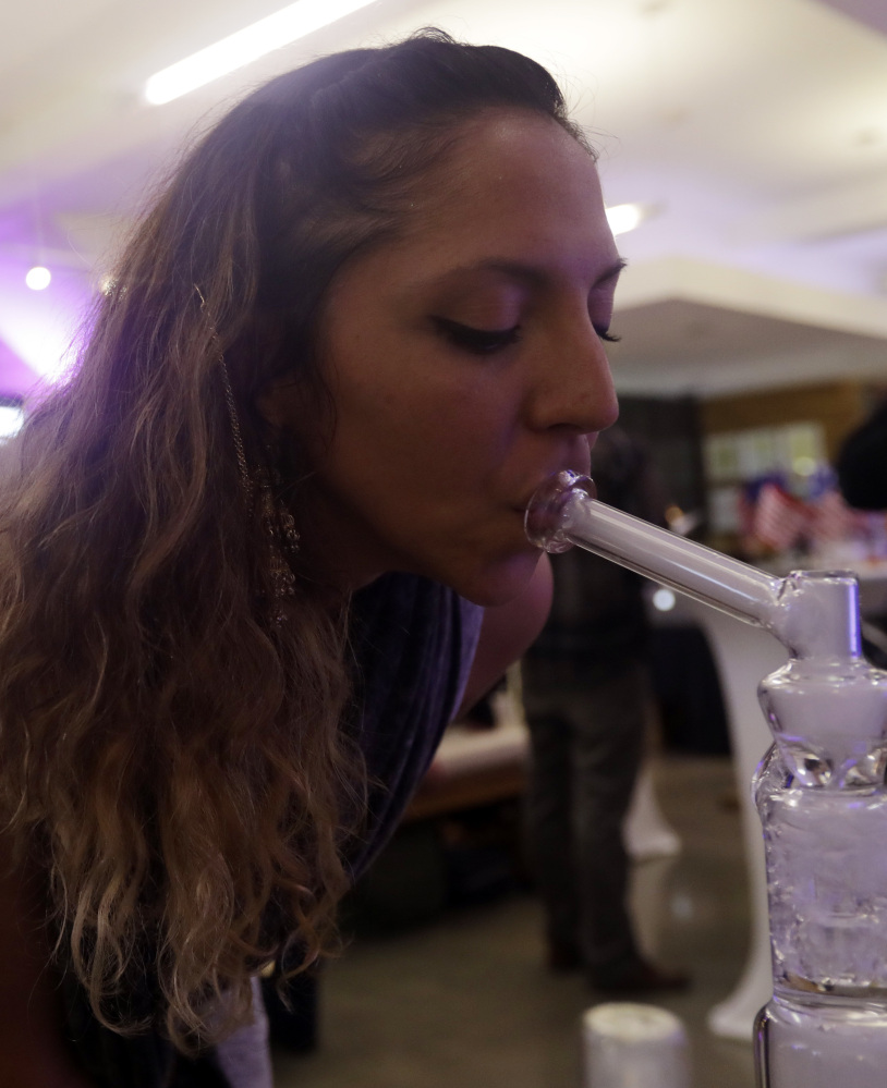 Krystal Xiques smokes marijuana Tuesday at a San Francisco rally in support of legalizing marijuana use.