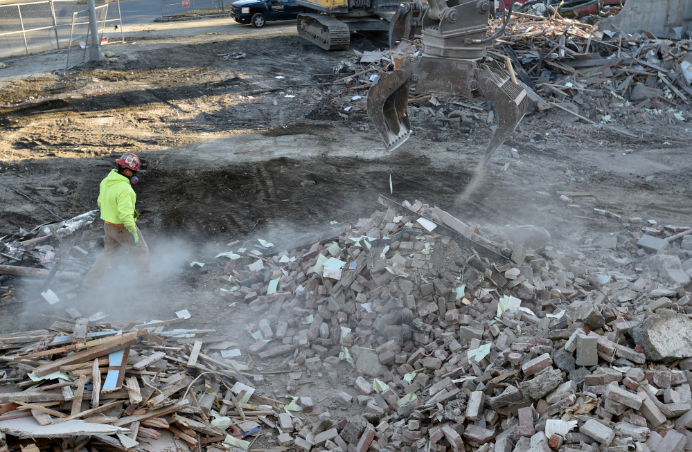 Crews from Costello Dismantling continue with the demolition of the former Levine's building in downtown Waterville on Nov. 1.