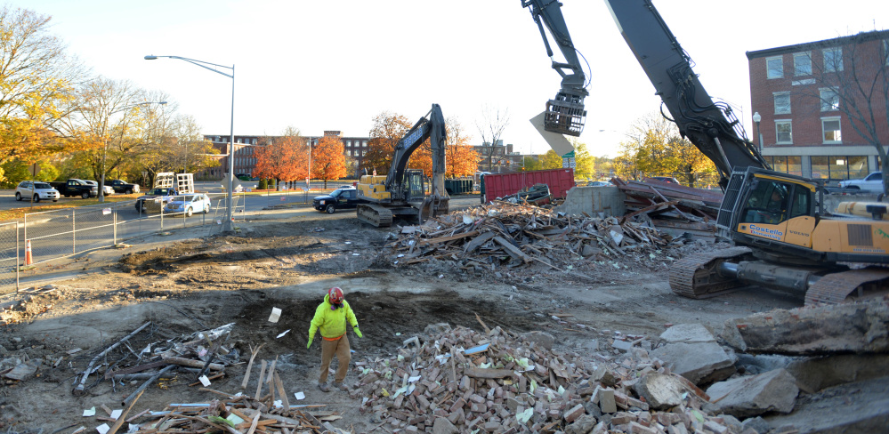 Crews from Costello Dismantling continue with the demolition of the former Levine's building in downtown Waterville on Nov. 1.