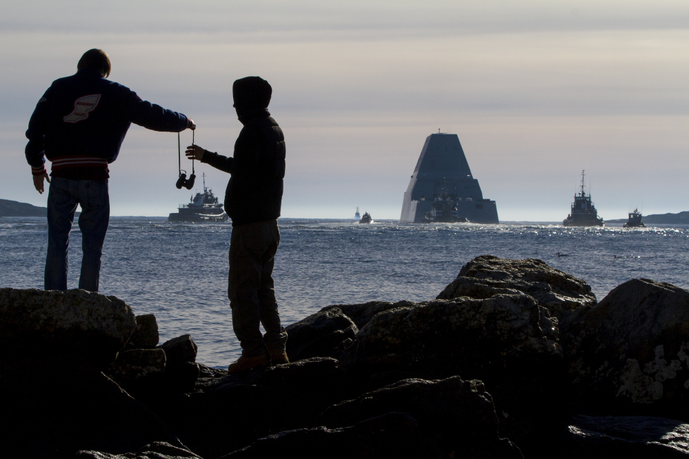 The Navy's newest destroyer, the Zumwalt, sails down the Kennebec River toward the Atlantic for a series of sea trials after leaving Bath Iron Works, where it was built.
