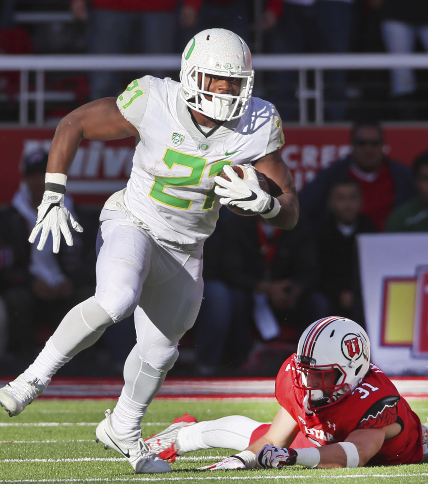 Oregon running back Royce Freeman slips away from Utah linebacker Evan Eggiman during the second half of Oregon's 30-28 upset against the 11th-ranked Utes.