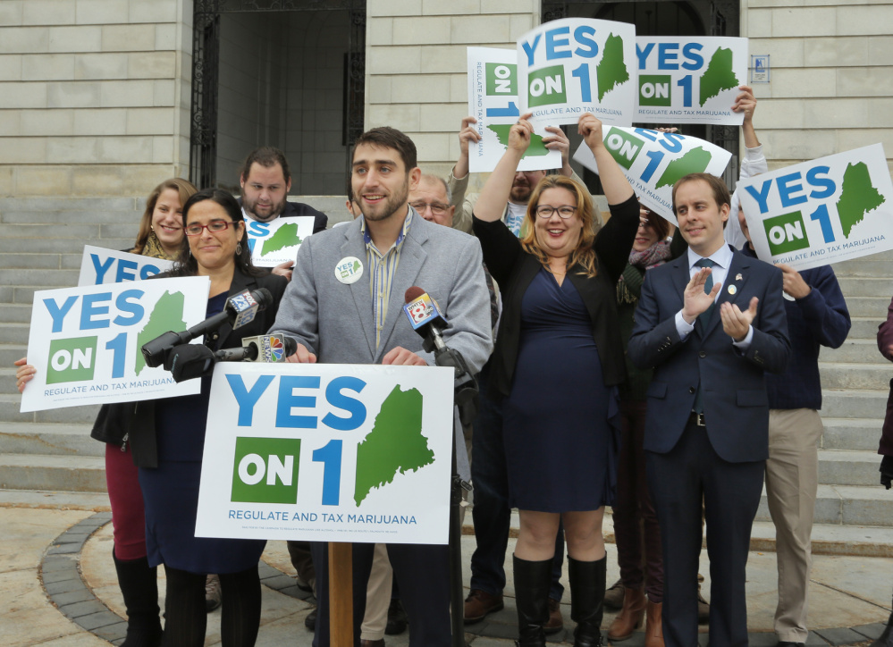 Proponents of the marijuana legalization referendum claim victory Nov. 9 at at City Hall in Portland. Recount results confirmed their victory, by about 4,000 votes.