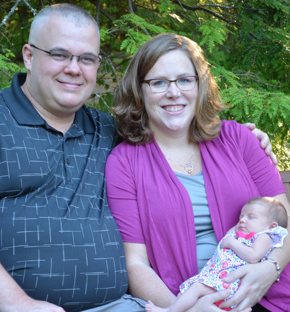 Mathew Guilfoyle, 38, a Winthrop dispatcher who died on Thanksgiving Day, is shown in this photo with his wife, Nicole, and daughter Eleanor.
