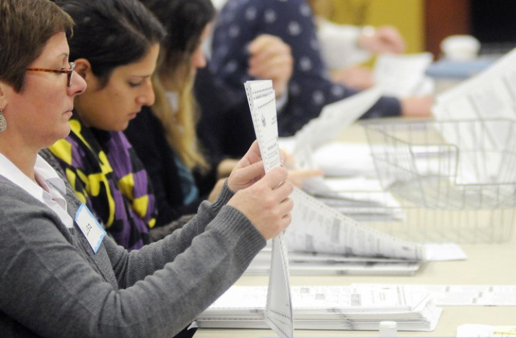 The hand recount of the marijuana referendum results began Dec. 5 at the Department of Public Safety in Augusta. The recount was suspended late Thursday, after about 30 percent of the ballots cast had been reviewed with no significant change in the totals.
