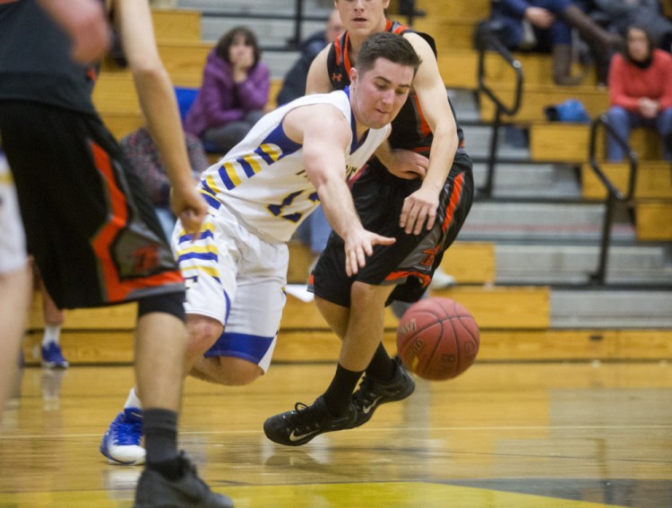 Falmouth's Colin Coyne tries to control the ball as he moves down the court during the Yachtsmen's 54-36 win over Brunswick on Tuesday.