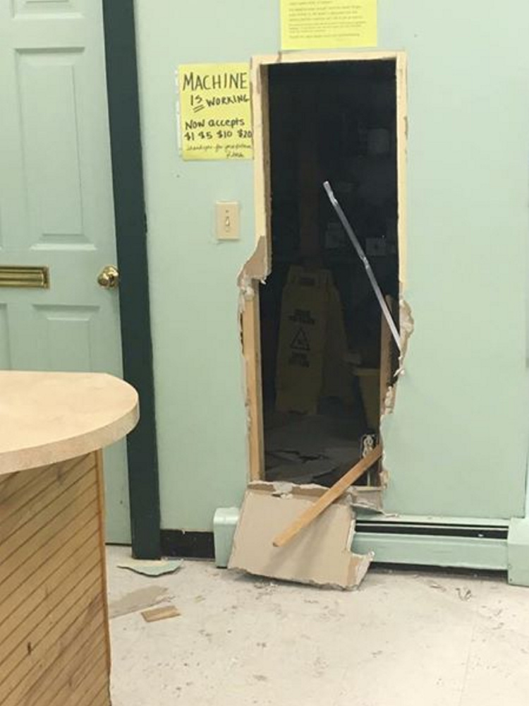 A photo taken by Rhonda Emerson, who owns Elm House Laundromat on Main Street in Madison, shows where a wall was knocked out Saturday and a coin change machine and safe was stolen.