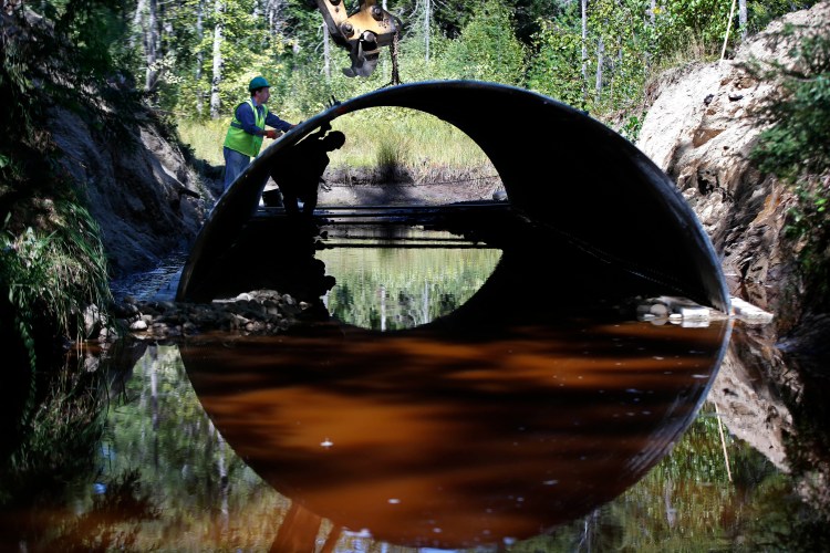 A bottomless arch culvert is installed in Passadumkeag. These are designed to withstand the impacts of severe storms, allowing fish habitat to stay open.