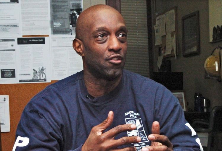 Skowhegan Police officer Tim Williams speaks Monday about how he responded to a fire at a mobile home in Skowhegan on Friday and crawled into the smoky home and helped drag to safety a mother and son. David Leaming/Staff Photographer