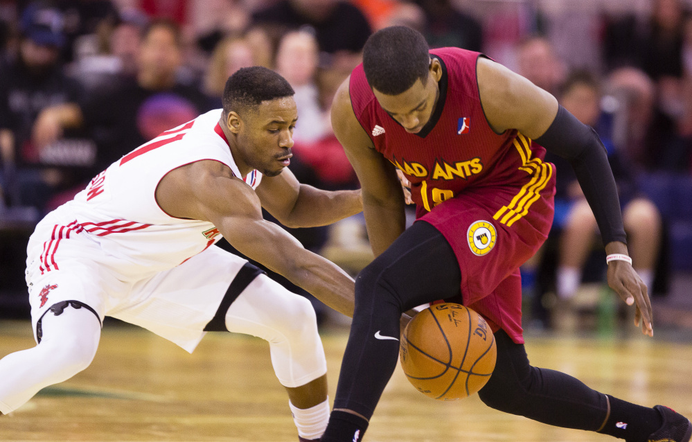 Red Claws guard Demetrius Jackson knocks the ball away from Jordan Lloyd for the Fort Wayne Mad Ants during Sunday's game at the Expo. Maine won, 111-103.