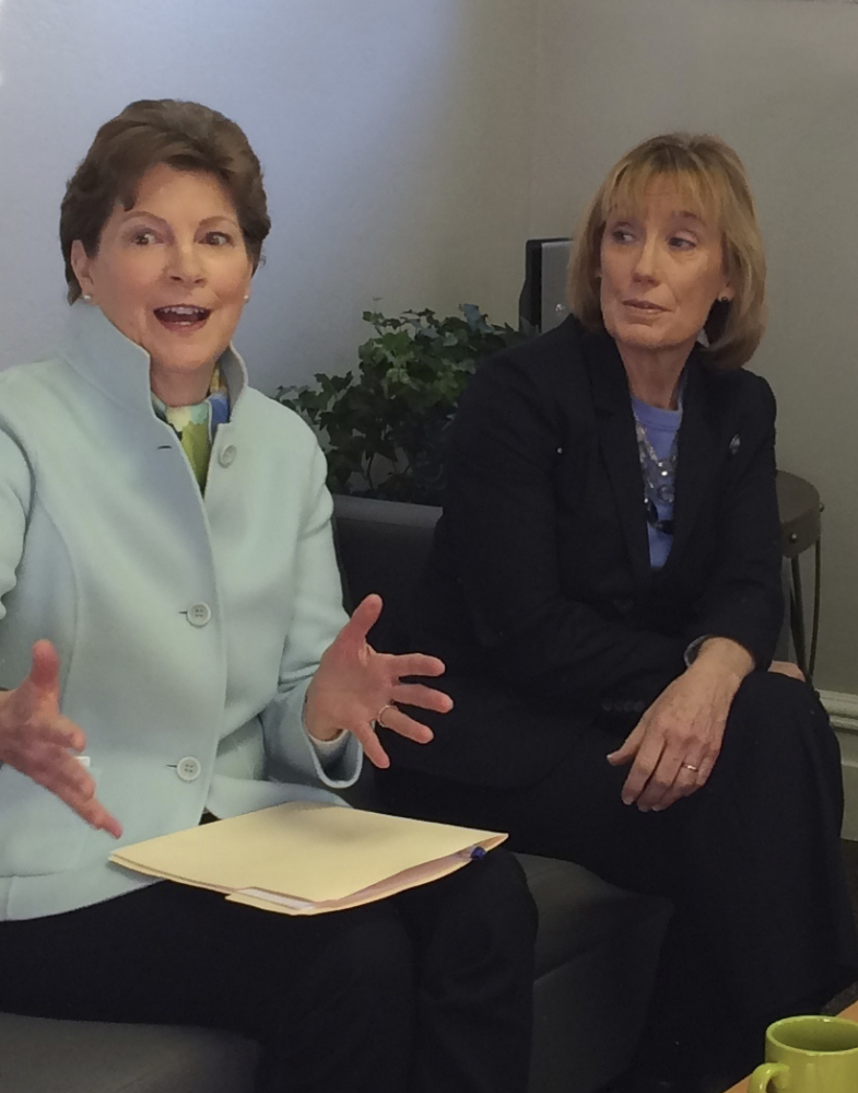 Sens. Jeanne Shaheen, left, and Maggie Hassan speak at a clinic in Exeter, N.H., on Monday. They are working to remind women of the health care benefits provided by Planned Parenthood.