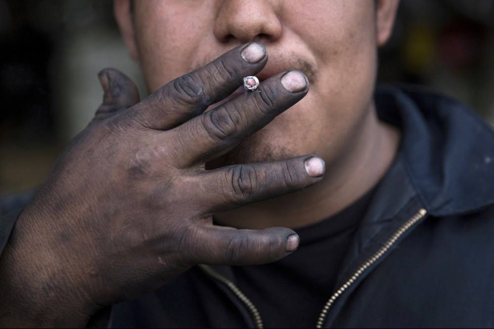 With 80 percent of the world's 1.1 billion smokers living in low- and middle-income countries, the poor are disproportionately burdened, a new report says.