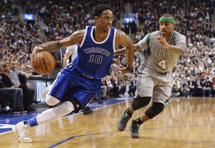 Toronto Raptors guard DeMar DeRozan, 10, drives past Boston Celtics guard Isaiah Thomas during the second half Tuesday in Toronto.