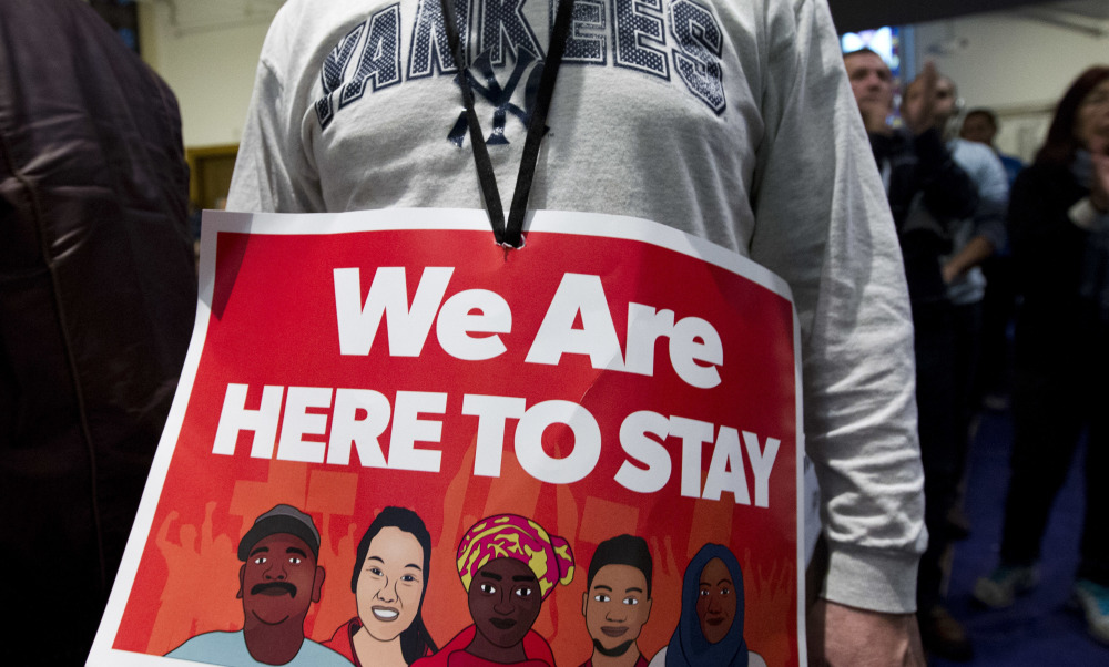 Immigrant rights advocates demonstrate during a rally at Metropolitan AME Church in Washington on Saturday.