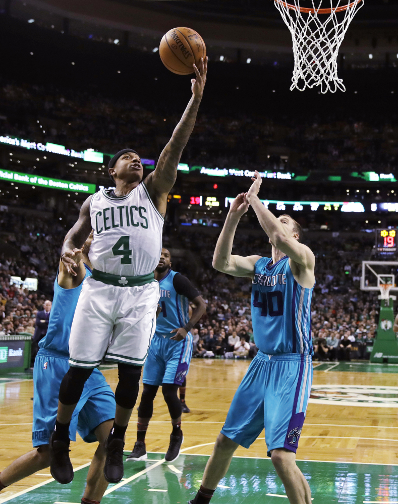 Isaiah Thomas drives to the basket past Hornets center Cody Zeller in the first quarter of the Celtics' 108-98 home win.