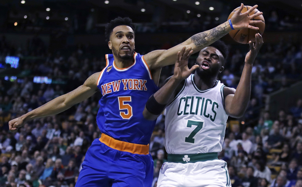 Knicks guard Courtney Lee breaks up a drive to the basket by Boston's Jaylen Brown in the first quarter of Wednesday's game at Boston.