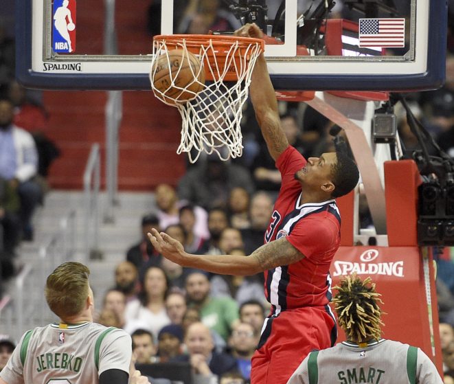 Washington Wizards guard Bradley Beal against Boston Celtics forward Jonas Jerebko and guard Marcus Smart during the second half Tuesday.