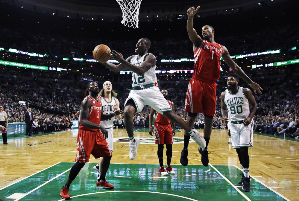 Boston's Terry Rozier drives to the basket past Houston's Trevor Ariza in the first quarter of Wednesday's game at Boston.