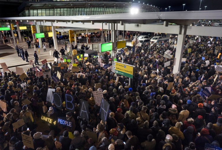 Protesters assemble at John F. Kennedy International Airport in New York, Saturday, Jan. 28, 2017 after earlier in the day two Iraqi refugees were detained while trying to enter the country. On Friday, Jan. 27, President Donald Trump signed an executive order suspending all immigration from countries with terrorism concerns for 90 days. Countries included in the ban are Iraq, Syria, Iran, Sudan, Libya, Somalia and Yemen, which are all Muslim-majority nations.