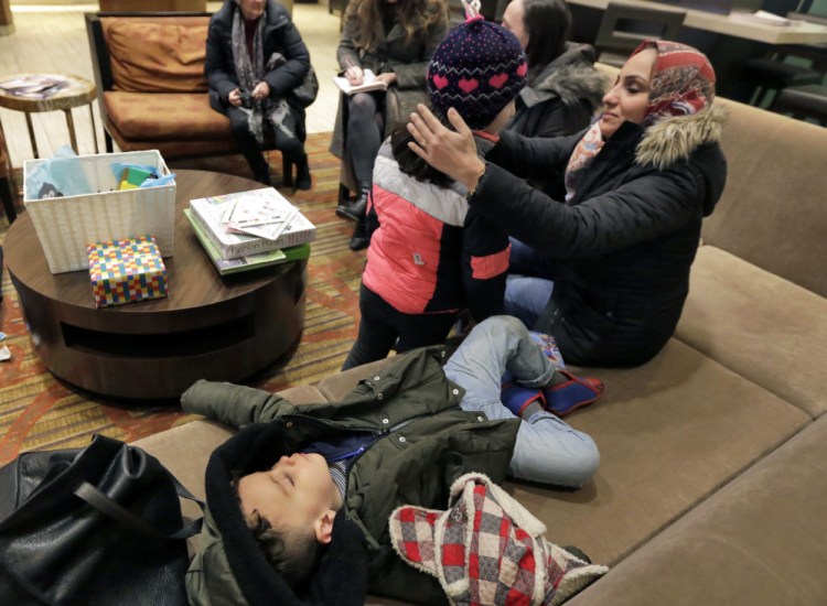 Hiba Alaskry waits in the lobby of a New York hotel on Friday after being admitted from Iraq, thanks to a reprieve granted to them because Munther Alaskry, Hiba's husband, was an interpreter who helped the U.S.