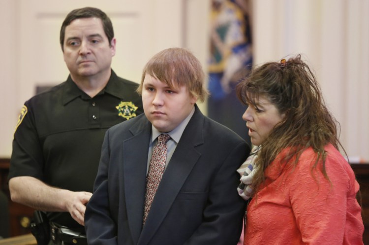 Dylan Collins is escorted into York County Superior Court on Tuesday, when he pleaded guilty to setting a fire in 2014 that killed two men. At right is his attorney Amy Fairfield.