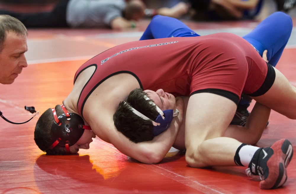  The official takes a close look to see if Michael Wrigley of Wells completes the pin of Jessie Pelletier of Mountain Valley during during the 170-pound final of the Class B South wrestling championships at Wells High School on Saturday. Wrigley went on to pin Pelletier, helping his team win the overall championship.
Carl D. Walsh/Staff Photographer 