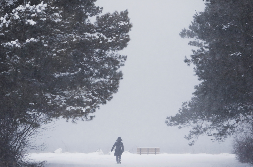 Emma Tallack ventured out to Bug Light Park for some fresh air just as the snow began to fall and the wind picked up Sunday afternoon. 