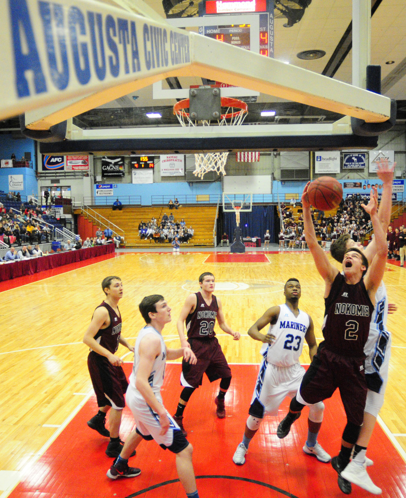 Nokomis' Joshua Smestad, 2, and Oceanside's Cooper Wirkala, right, go for a rebound during a Class A North semifinal game on Saturday at Augusta Civic Center.