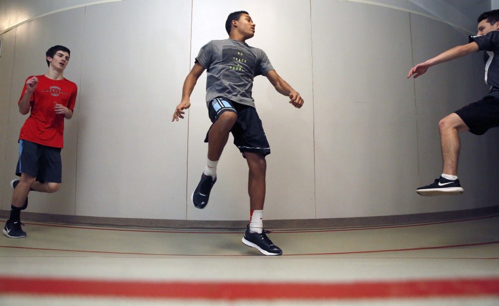 Scarborough freshman Jarett Flaker, center, joined a powerhouse indoor track and field team and has made it even better. Flaker is seeded first in the 55-meters and second in the 200 in the Class A state meet as the Red Storm seek to defend their title.