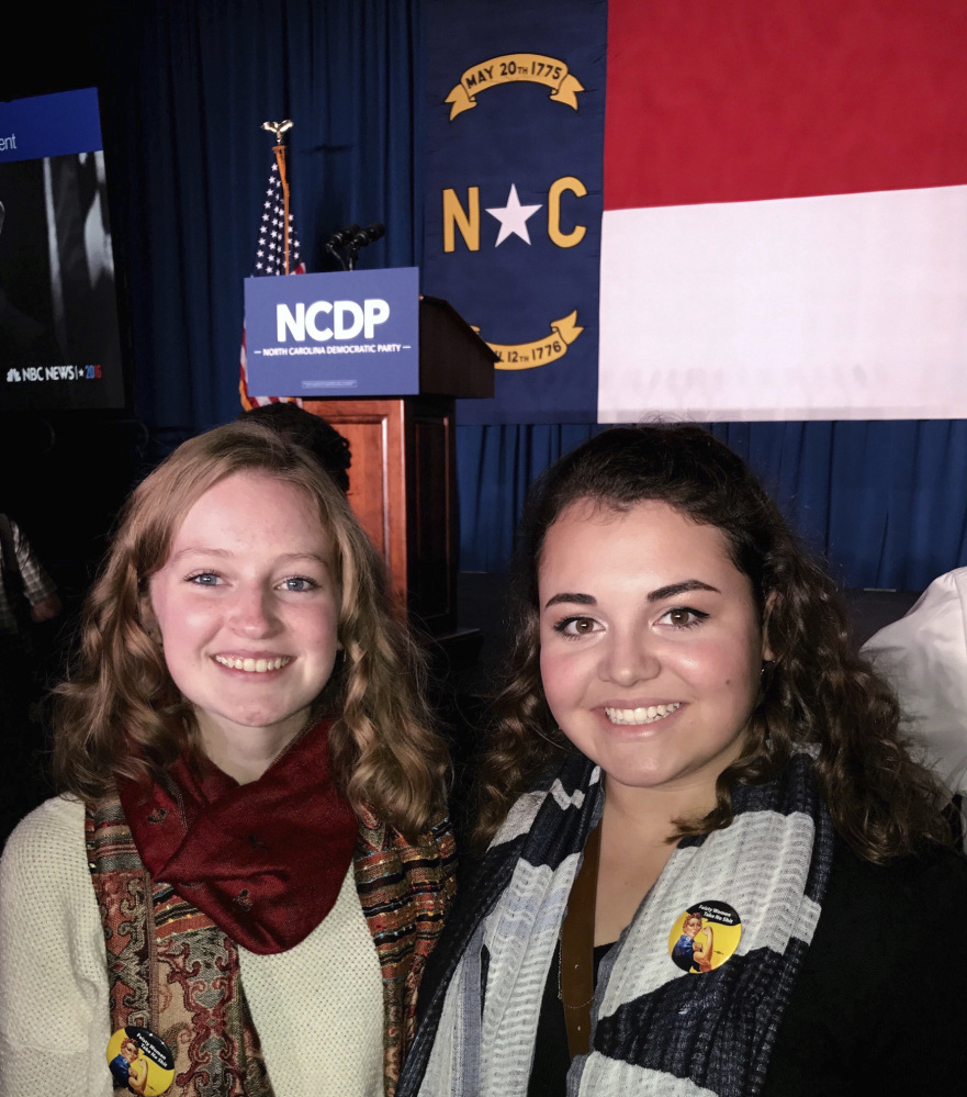 Caroline Millsaps, 16, left and her friend Kristin Barta attend a North Carolina Democratic Party event in 2016. Millsaps is one of 790 teenagers who took part in the Associated Press-NORC Center for Public Affairs poll.