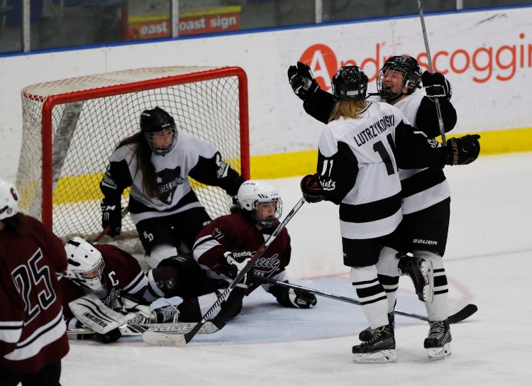 St. Dominic's Avery Lutraykowski celebrates a goal in the third period Thursday night in Lewiston.