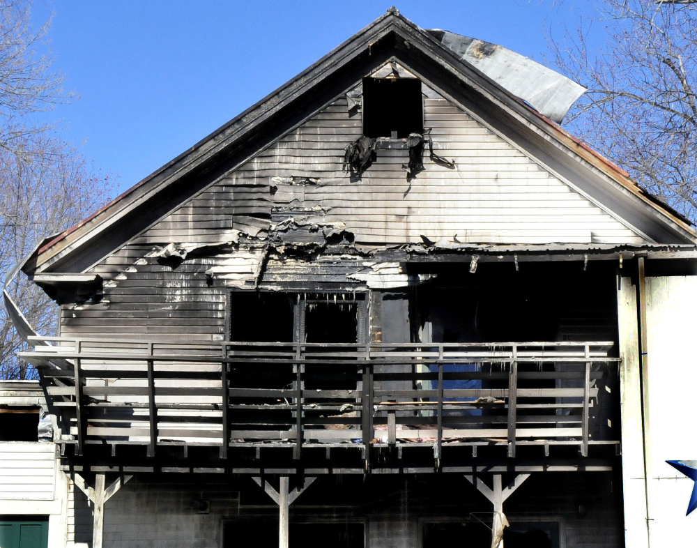 A tenant of an apartment complex at 152 Main St. in Madison says he was smoking Saturday shortly before a fire erupted, destroying more than half of the building.