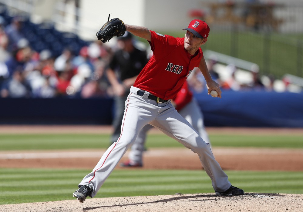 Red Sox starting pitcher Chris Sale made his spring training debut, allowing two runs and striking out two, on Monday in West Palm Beach, Fla.