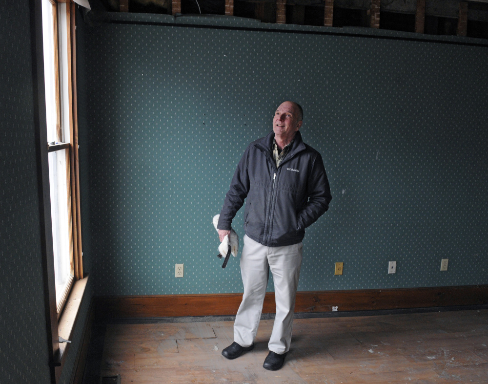 Terry Berry looks around Tuesday inside the Water Street building he recently bought in downtown Gardiner.