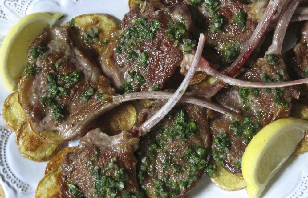 Seared lamb chops with mint herb sauce.